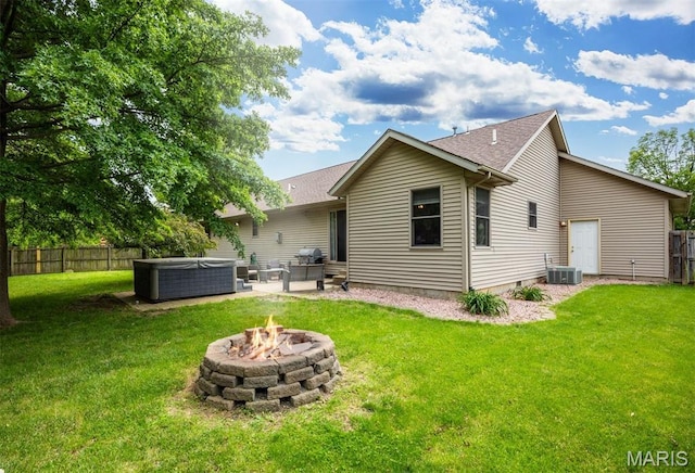 248 Prairie Grass Rd, Chatham, IL 62629 - rear view of house with a fire pit, a hot tub, and central air condition unit