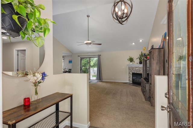 248 Prairie Grass Rd, Chatham, IL 62629 - entryway with lofted ceiling, carpet flooring, a stone fireplace, a ceiling fan, and a chandelier