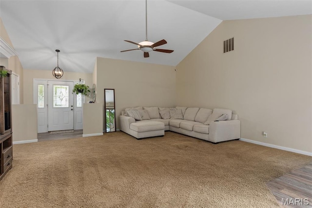 248 Prairie Grass Rd, Chatham, IL 62629 - carpeted living room with lofted ceiling, a ceiling fan, a chandelier, and baseboards