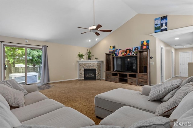 248 Prairie Grass Rd, Chatham, IL 62629 - carpeted living room featuring vaulted ceiling, a ceiling fan, a stone fireplace, and baseboards