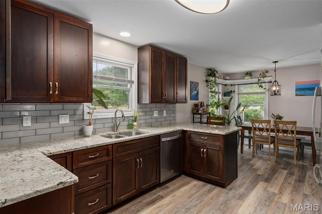 248 Prairie Grass Rd, Chatham, IL 62629 - kitchen featuring stainless steel dishwasher, a sink, light wood-type flooring, and backsplash