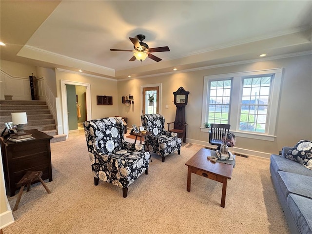 4001 W Ely Rd, Hannibal, MO 63401 - living room with a tray ceiling, light colored carpet, stairs, crown molding, and a ceiling fan