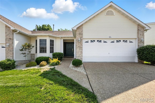 105 Silo Valley Dr, Wentzville, MO 63385 - ranch-style house featuring a garage, driveway, a front lawn, and brick siding
