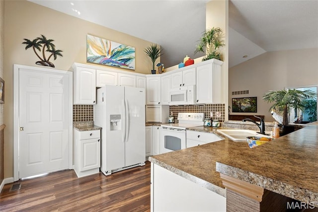 105 Silo Valley Dr, Wentzville, MO 63385 - kitchen with white appliances, lofted ceiling, a peninsula, dark wood finished floors, and tasteful backsplash