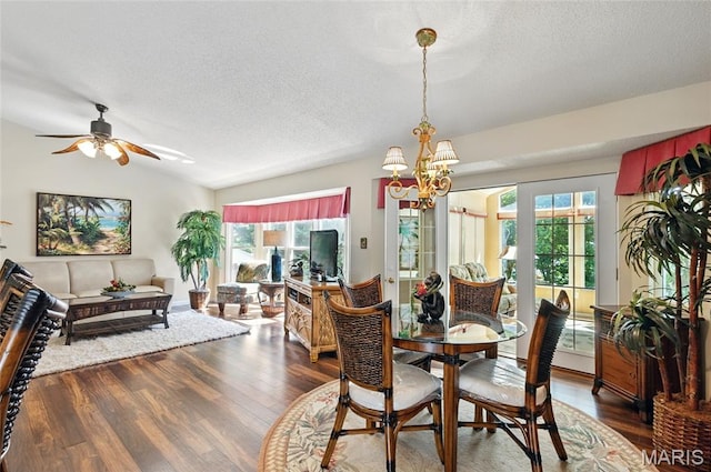 105 Silo Valley Dr, Wentzville, MO 63385 - dining area featuring a textured ceiling, wood finished floors, healthy amount of natural light, lofted ceiling, and a chandelier