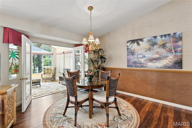 105 Silo Valley Dr, Wentzville, MO 63385 - dining area with wallpapered walls, vaulted ceiling, wood finished floors, a chandelier, and french doors