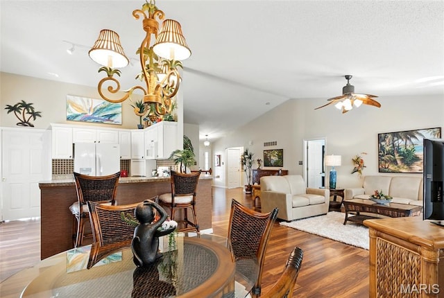 105 Silo Valley Dr, Wentzville, MO 63385 - dining area with wood finished floors, ceiling fan, and high vaulted ceiling