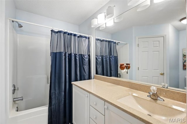 105 Silo Valley Dr, Wentzville, MO 63385 - bathroom with vanity, shower / bath combo, and a textured ceiling
