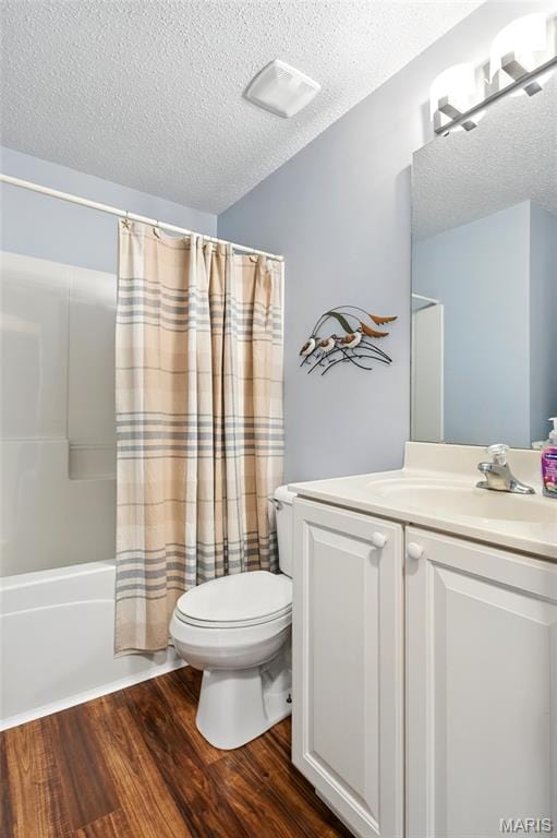 105 Silo Valley Dr, Wentzville, MO 63385 - bathroom with a textured ceiling, wood finished floors, vanity, and shower / tub combo