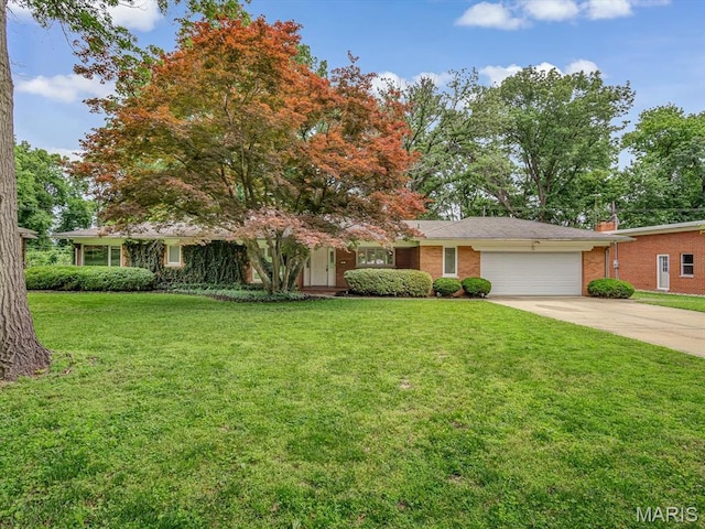 68 Carnation Dr, Belleville, IL 62221 - ranch-style home featuring a garage, concrete driveway, a front lawn, brick siding, and a chimney