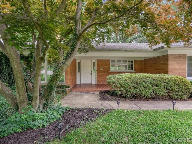 68 Carnation Dr, Belleville, IL 62221 - view of front facade featuring brick siding and covered porch