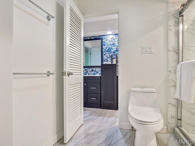 68 Carnation Dr, Belleville, IL 62221 - bathroom with toilet, a shower stall, baseboards, and vanity