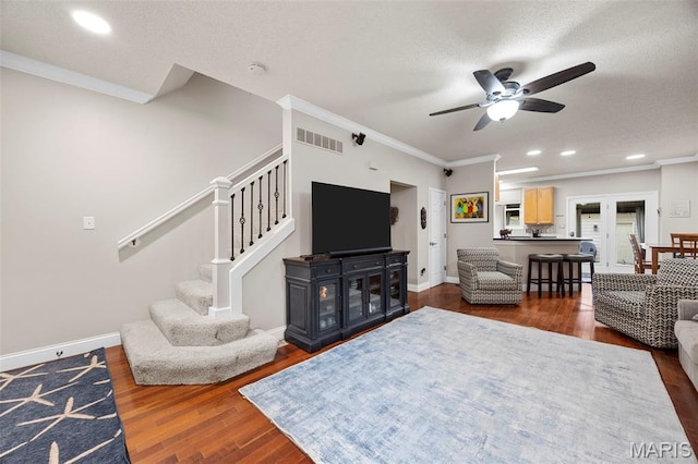 3216 Domain St, Saint Charles, MO 63301 - living area featuring ornamental molding, a ceiling fan, stairway, dark wood finished floors, and recessed lighting