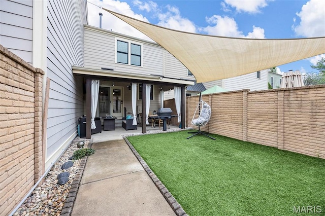3216 Domain St, Saint Charles, MO 63301 - rear view of house featuring a fenced backyard, a patio area, and outdoor lounge area