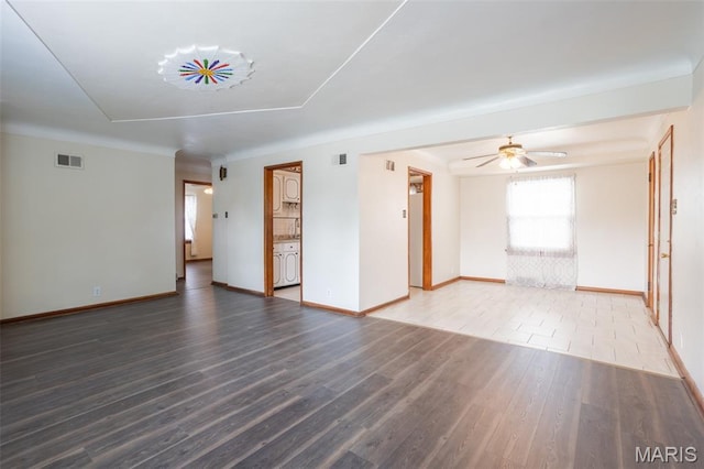 529 Maple Meadows Dr, Arnold, MO 63010 - unfurnished living room with wood finished floors, baseboards, and a ceiling fan