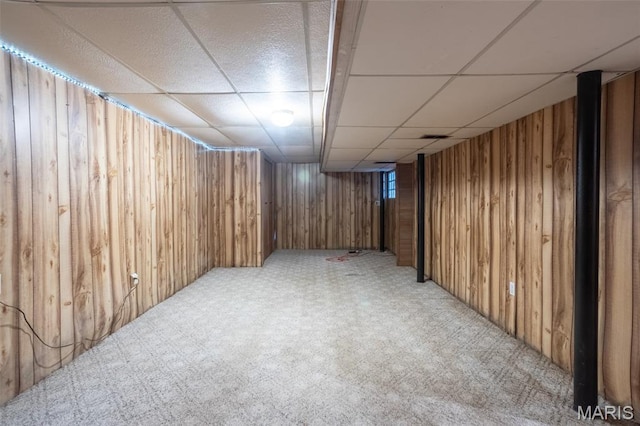 529 Maple Meadows Dr, Arnold, MO 63010 - finished basement with a paneled ceiling, wood walls, and light carpet