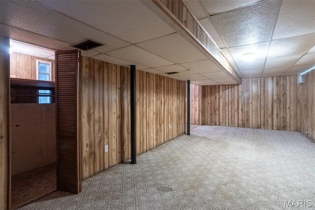529 Maple Meadows Dr, Arnold, MO 63010 - basement featuring wooden walls, a drop ceiling, and carpet floors