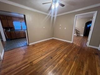 408 Summit, Doniphan, MO 63935 - empty room with crown molding, a ceiling fan, dark wood finished floors, and baseboards