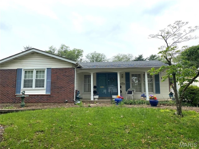 2287 Woodgrass Dr, Overland, MO 63114 - ranch-style house featuring a porch, a front yard, and brick siding