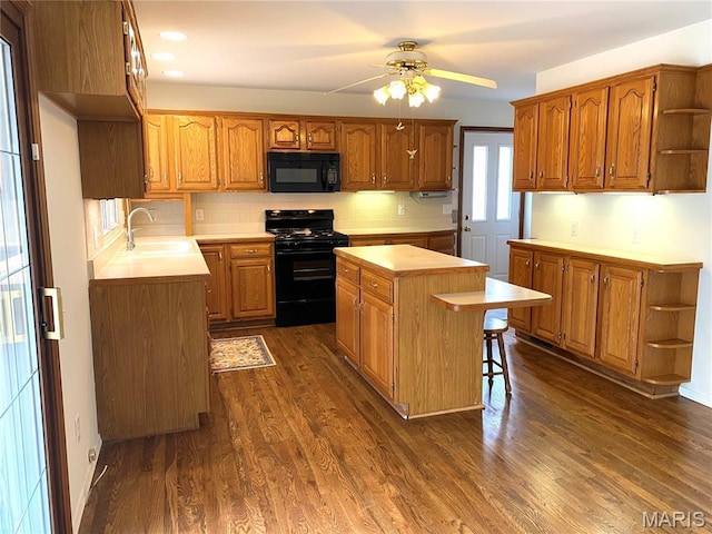 2287 Woodgrass Dr, Overland, MO 63114 - kitchen featuring black appliances, open shelves, a sink, a center island, and light countertops