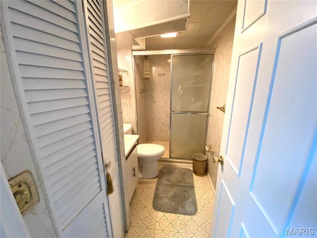 2287 Woodgrass Dr, Overland, MO 63114 - bathroom featuring toilet, a stall shower, and vanity