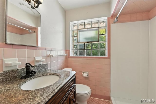 6912 Hampton Ave, Saint Louis, MO 63109 - full bath with a shower, tile walls, vanity, tile patterned floors, and a wainscoted wall