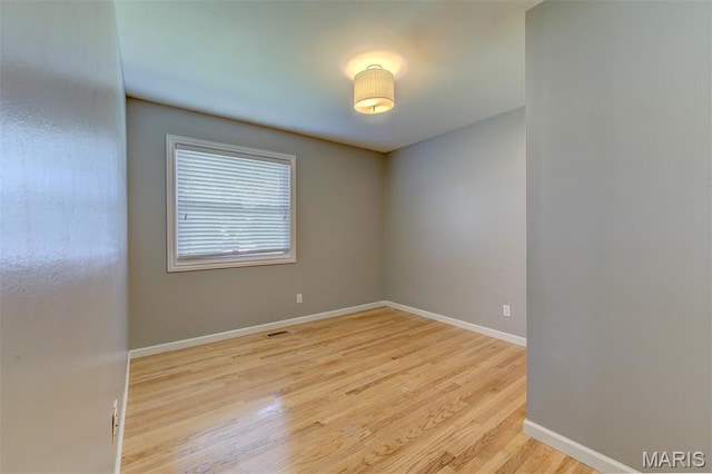 36 Huck Finn Dr, Saint Charles, MO 63303 - unfurnished room featuring wood finished floors and baseboards