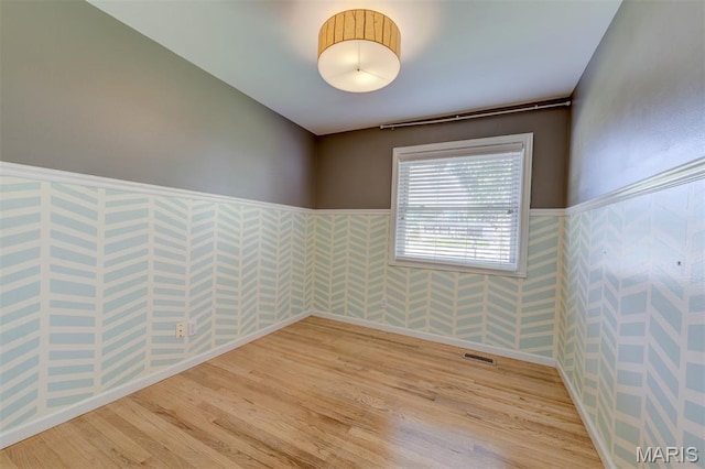 36 Huck Finn Dr, Saint Charles, MO 63303 - spare room with a wainscoted wall and light wood finished floors