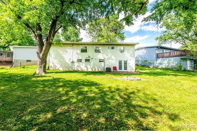 36 Huck Finn Dr, Saint Charles, MO 63303 - back of house featuring french doors and a lawn
