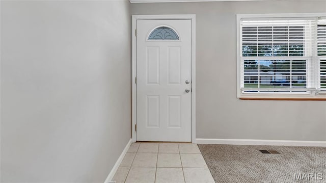 995 Sherman Ln, Florissant, MO 63031 - entrance foyer with baseboards and light tile patterned floors