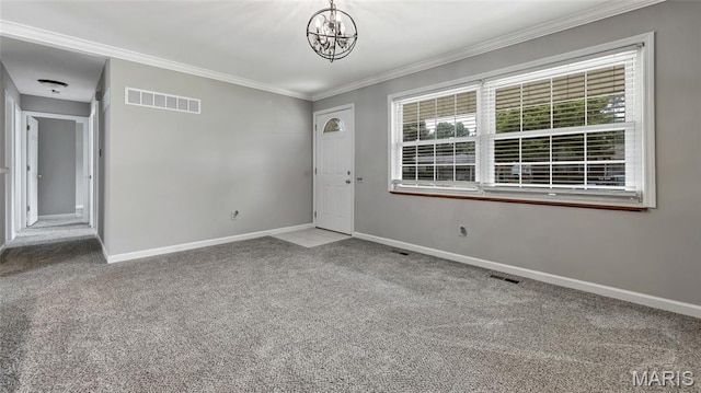 995 Sherman Ln, Florissant, MO 63031 - foyer entrance with a chandelier, carpet flooring, baseboards, and crown molding