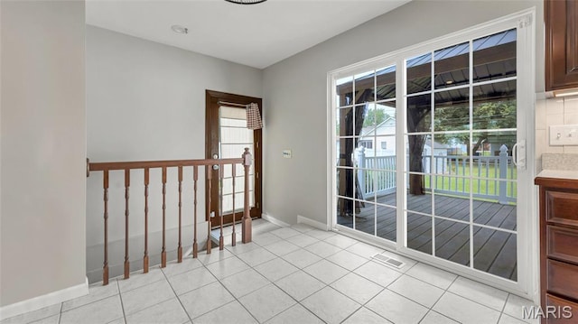 995 Sherman Ln, Florissant, MO 63031 - spare room featuring baseboards and light tile patterned floors
