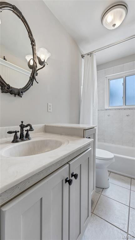 995 Sherman Ln, Florissant, MO 63031 - bathroom with vanity, toilet, tile patterned flooring, and shower / bath combination with curtain