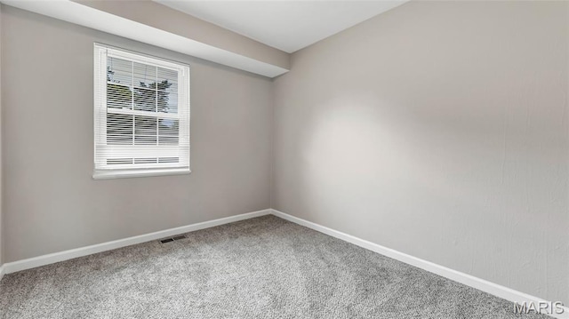 995 Sherman Ln, Florissant, MO 63031 - carpeted spare room featuring baseboards