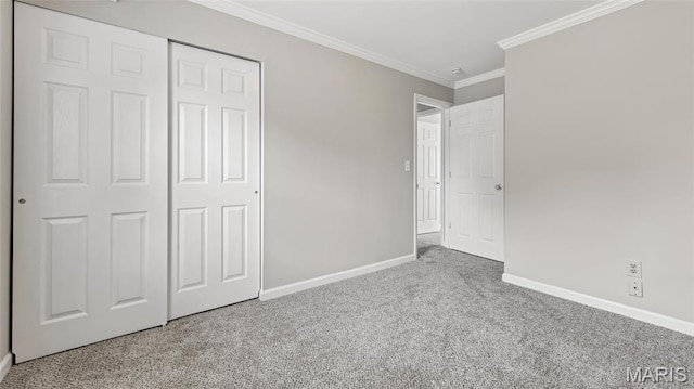 995 Sherman Ln, Florissant, MO 63031 - unfurnished bedroom with carpet floors, baseboards, ornamental molding, and a closet