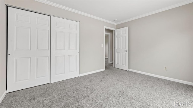 995 Sherman Ln, Florissant, MO 63031 - unfurnished bedroom featuring carpet, baseboards, crown molding, and a closet