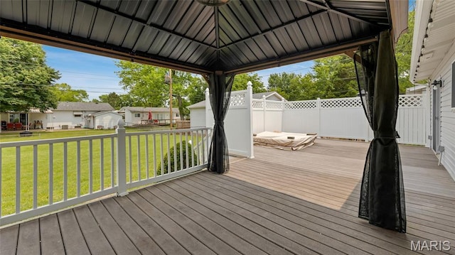 995 Sherman Ln, Florissant, MO 63031 - wooden deck featuring a lawn
