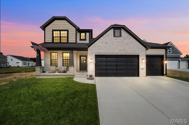 251 Randlin Dr, Ofallon, MO 63367 - view of front of house with a garage, a yard, a porch, and concrete driveway
