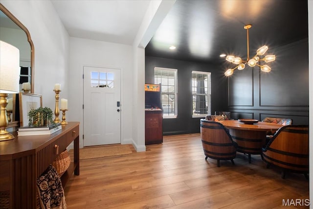 251 Randlin Dr, Ofallon, MO 63367 - foyer with a chandelier, wood finished floors, and recessed lighting