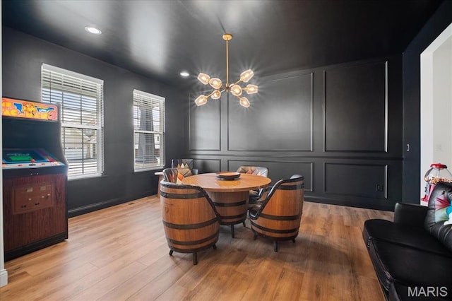 251 Randlin Dr, Ofallon, MO 63367 - dining room featuring light wood-style floors, recessed lighting, and a decorative wall