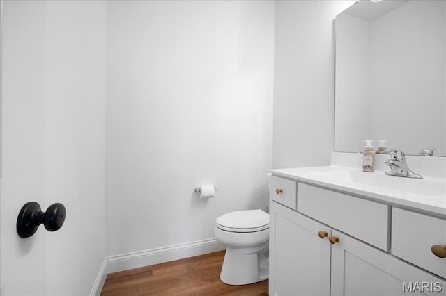 251 Randlin Dr, Ofallon, MO 63367 - half bath featuring vanity and wood finished floors