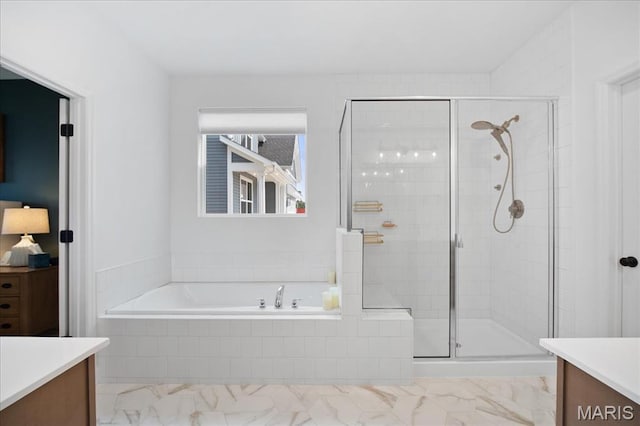 251 Randlin Dr, Ofallon, MO 63367 - bathroom with vanity, a bath, a stall shower, and marble look tile flooring