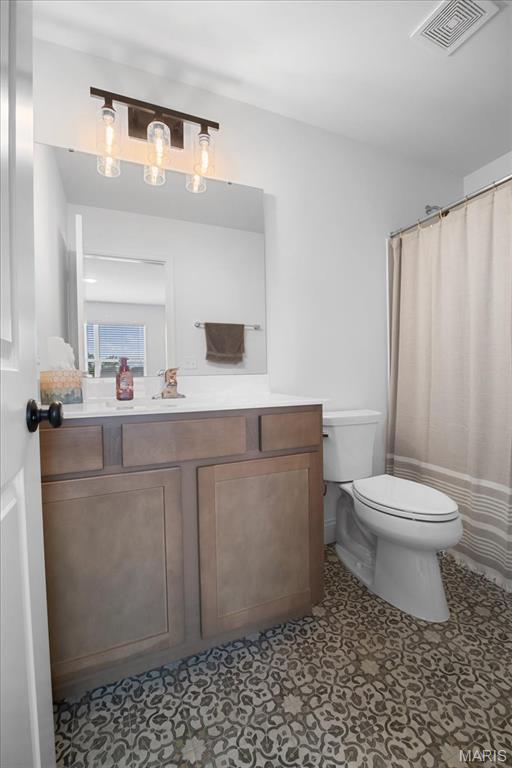 251 Randlin Dr, Ofallon, MO 63367 - full bathroom featuring vanity and a shower with curtain