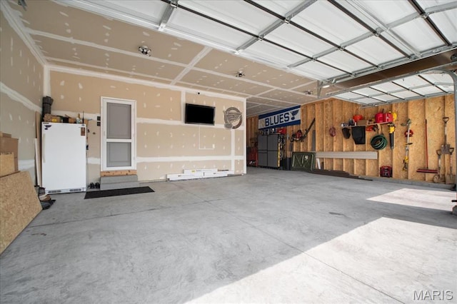 251 Randlin Dr, Ofallon, MO 63367 - garage with freestanding refrigerator and refrigerator