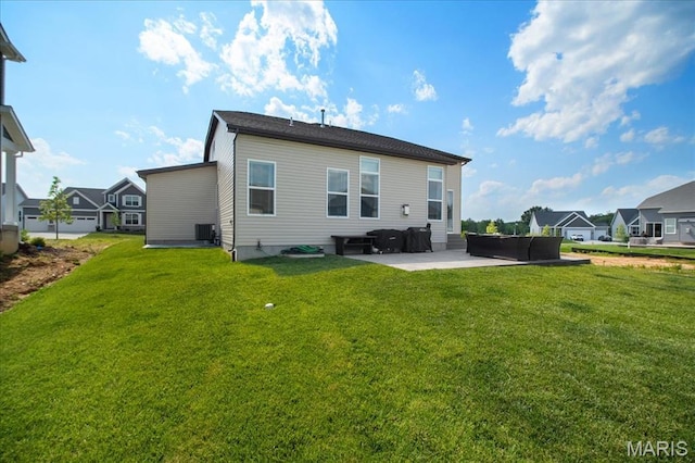 251 Randlin Dr, Ofallon, MO 63367 - back of property featuring a patio area, a lawn, and an outdoor hangout area