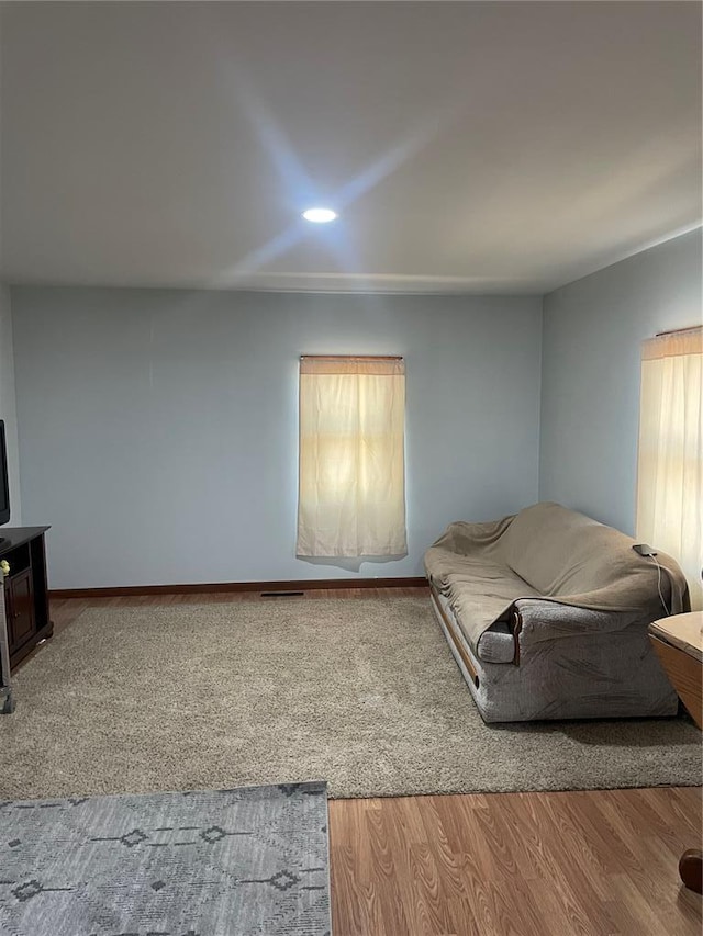 715 Lyon St, Hannibal, MO 63401 - living area with baseboards, recessed lighting, and wood finished floors