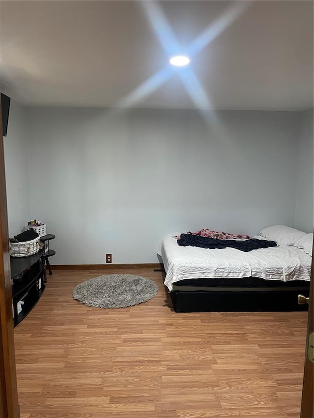 715 Lyon St, Hannibal, MO 63401 - bedroom featuring light wood-style floors and baseboards