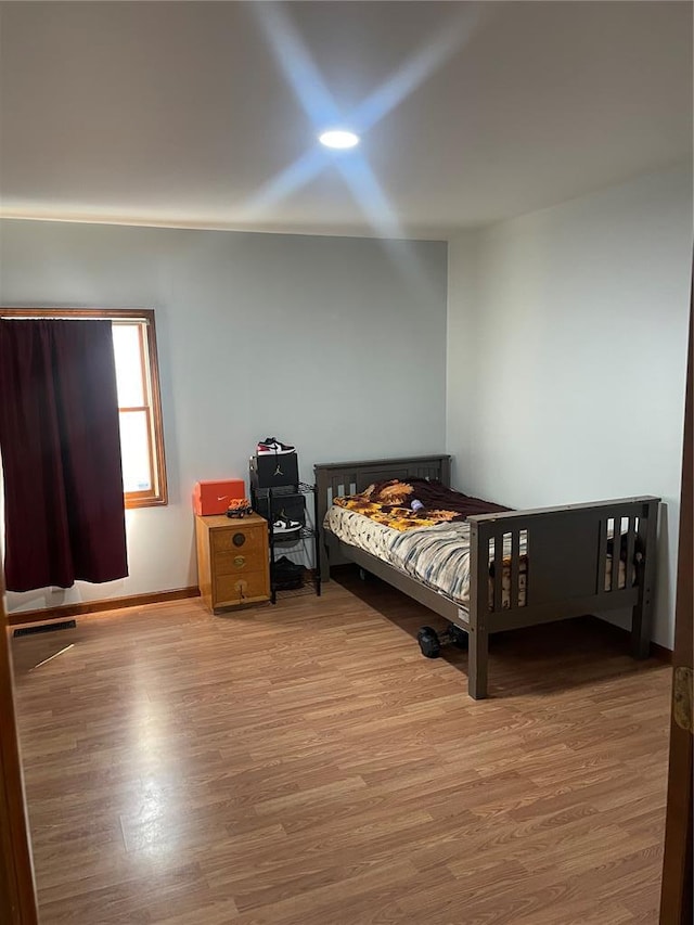 715 Lyon St, Hannibal, MO 63401 - bedroom featuring wood finished floors and baseboards