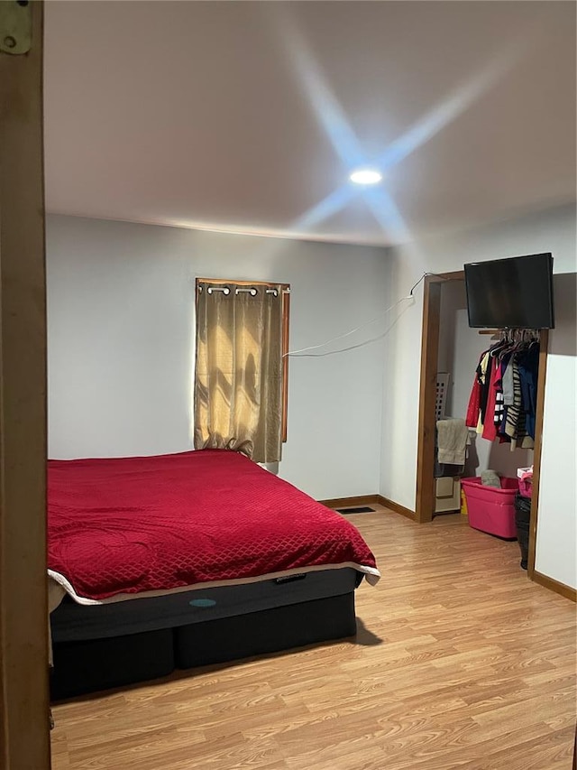 715 Lyon St, Hannibal, MO 63401 - bedroom with wood finished floors and baseboards