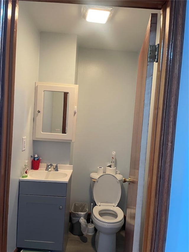 715 Lyon St, Hannibal, MO 63401 - half bathroom with vanity and toilet